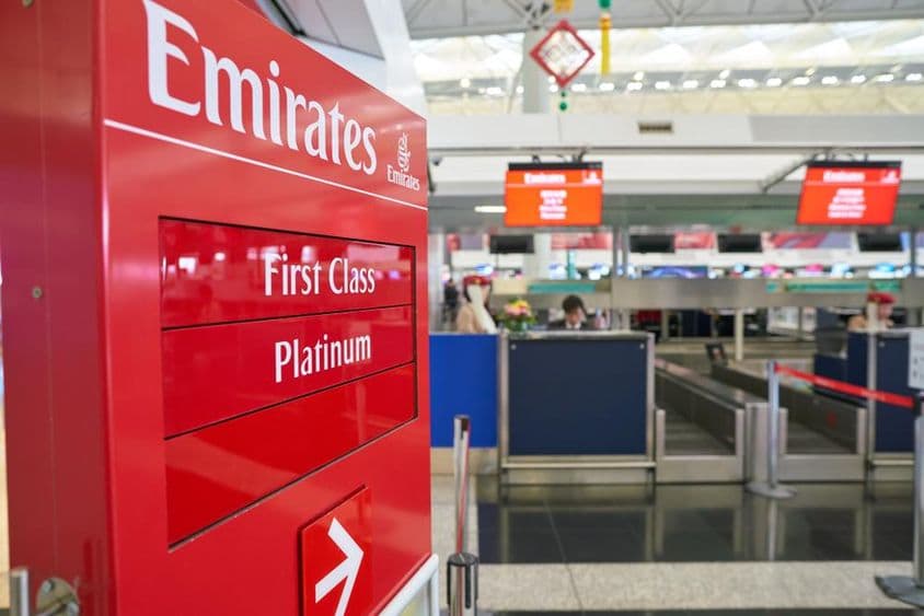 Emirates check-in area at Hong Kong International Airport.