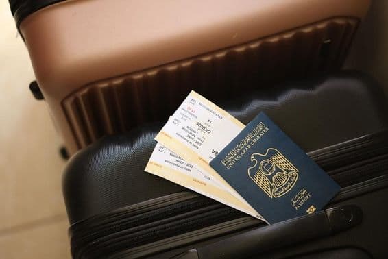 United Arab Emirates, a passport with tickets lying on a suitcase.