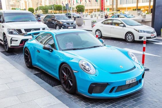Dubai, blue Porsche in the parking lot.