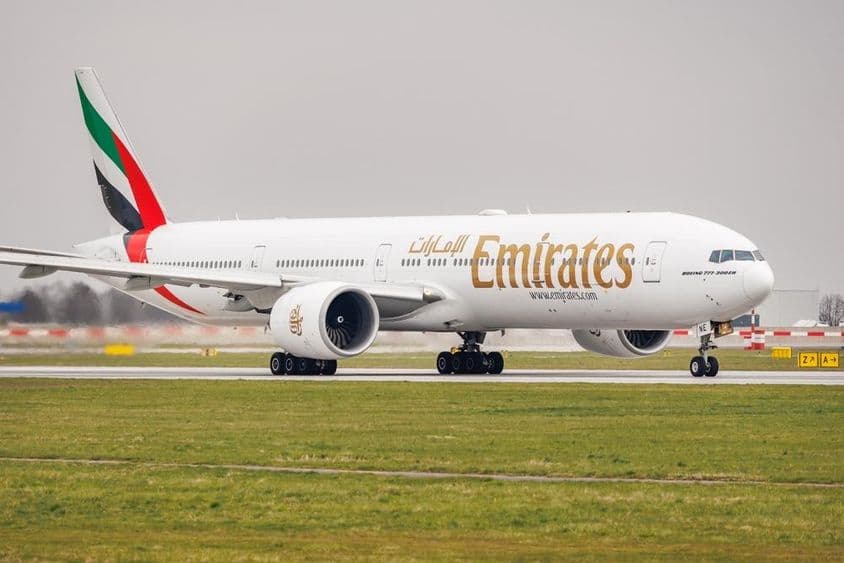 Emirates Boeing 777-31H taxiing on the runway.