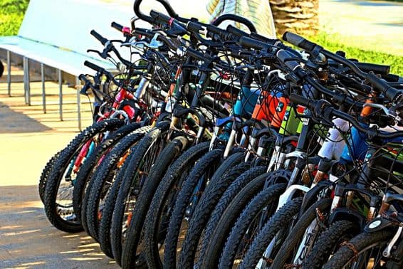 Bicycles in an outdoor parking area.