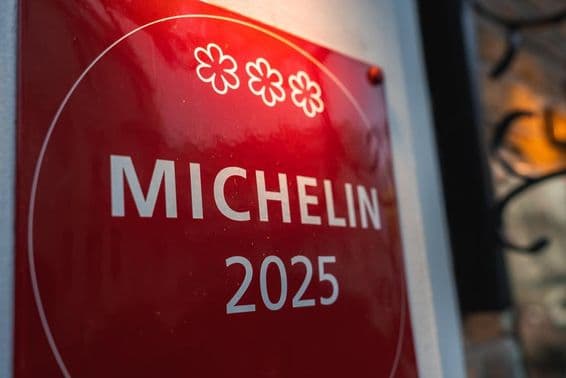 A red, three-star Michelin 2025 memorial plaque.
