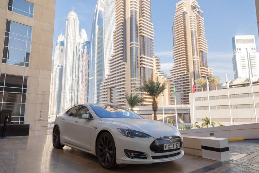 Electric Tesla car on the streets of Dubai.