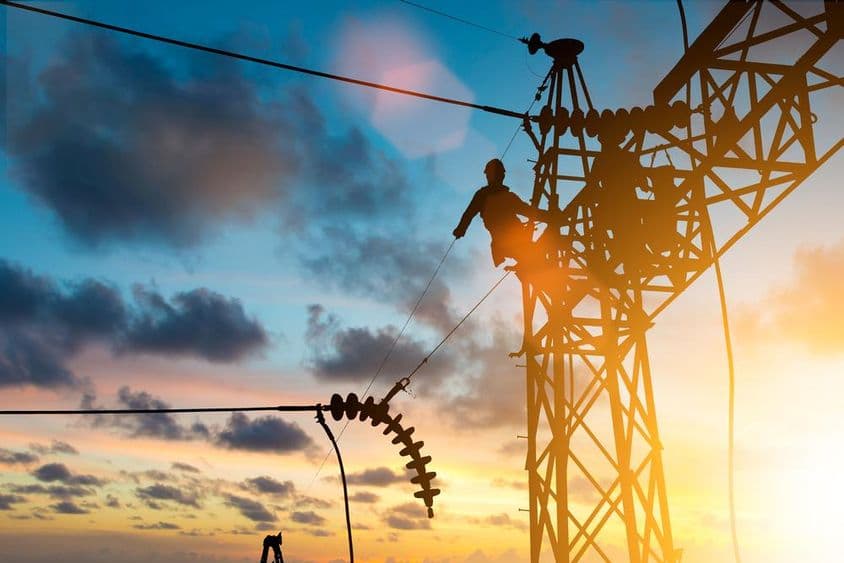 Electrician working on high voltage line.