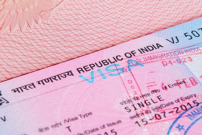 Indian tourist visa in a passport.