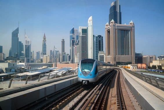 View from a metro train among skyscrapers in Dubai.