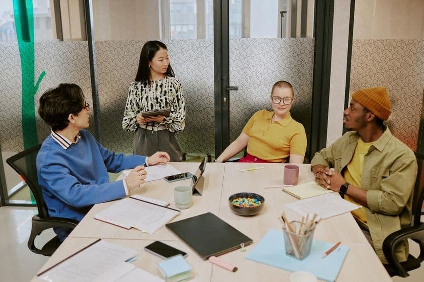 Generation Z colleagues working together on a business plan.