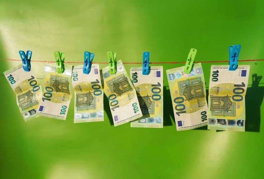 100 euro banknotes drying on a clothesline.