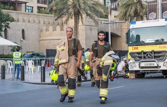 Firefighters in Dubai extinguishing a successfully contained fire.