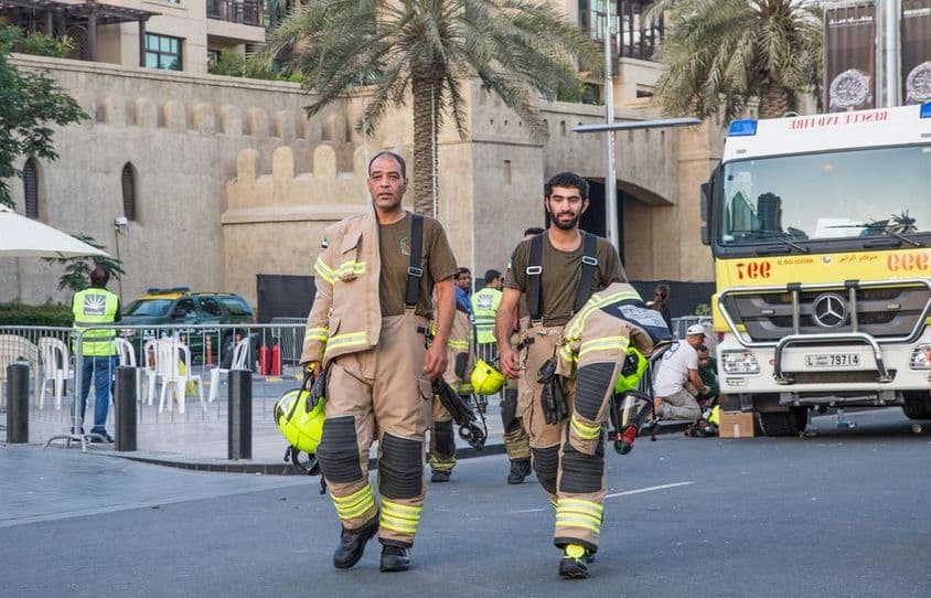 Firefighters in Dubai extinguishing a successfully contained fire.