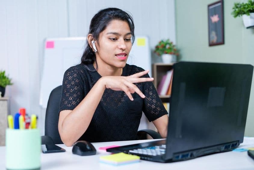 Young Indian businesswoman convincing a client about a project over a video call.