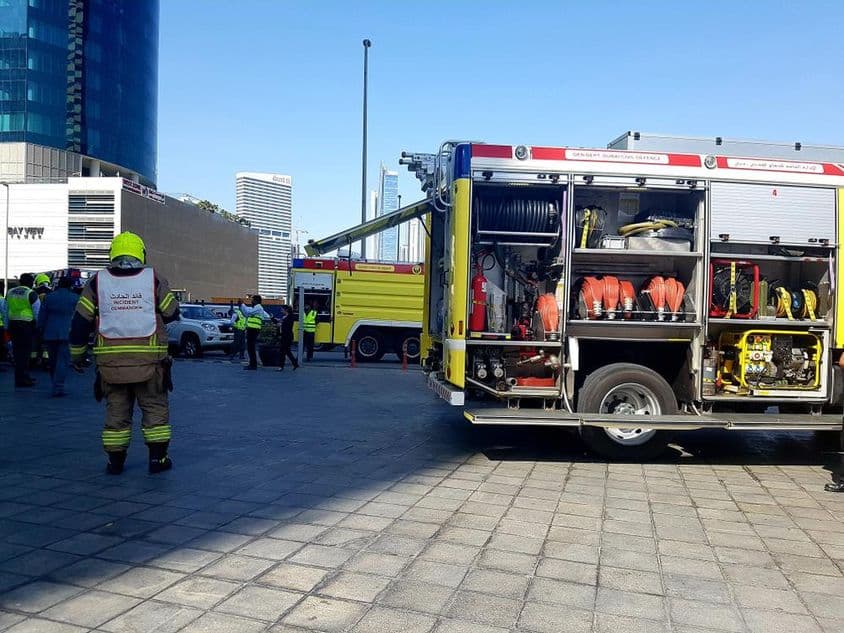 Dubai fire chief near a fire truck during practice.