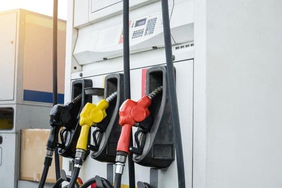 Dubai gas station with black, yellow, red pumps.