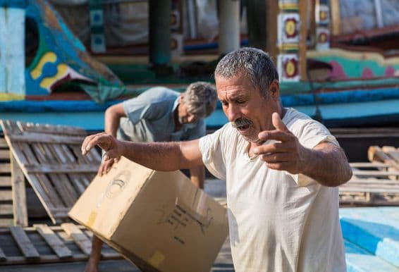 Iranian male crew worker on a boat at Dubai Creek.