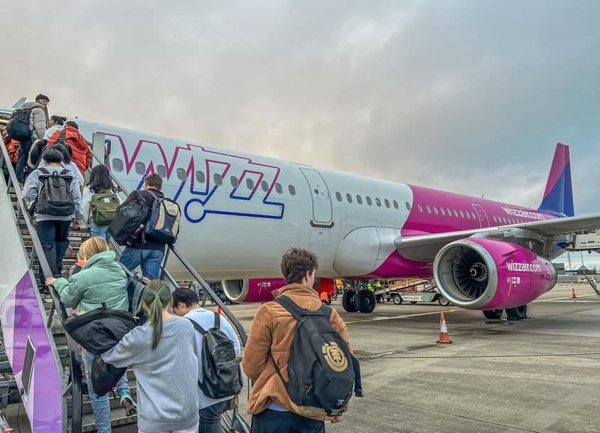 Backpackers boarding a Wizz Air airline plane