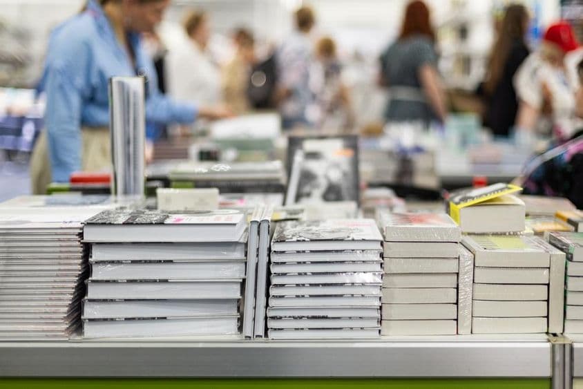 Visitor interested in books, XIX International Book Salon.