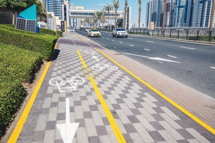Dubai, United Arab Emirates: White painted bike lane on the sidewalk.