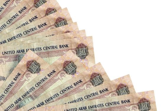 50 United Arab Emirates dirham banknote lying on a table.