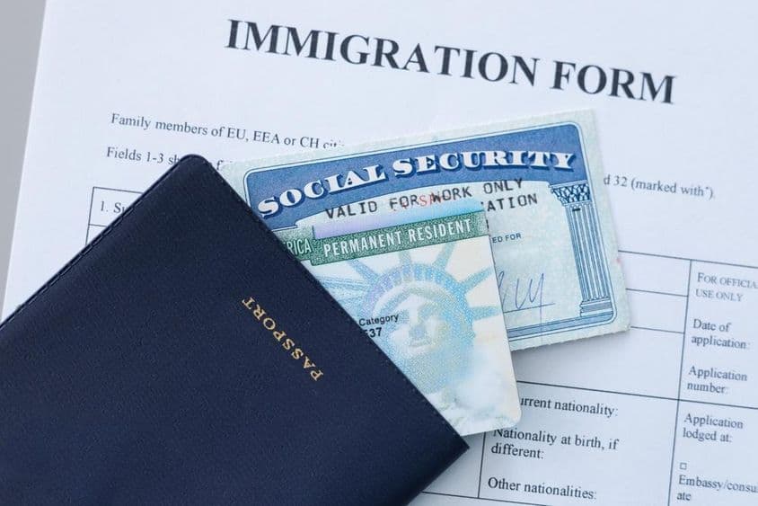 USA passport, social security card, and permanent residence (green) card.