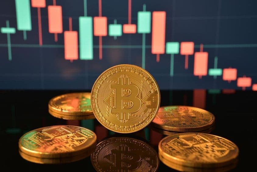 A pile of gold Bitcoin coins.