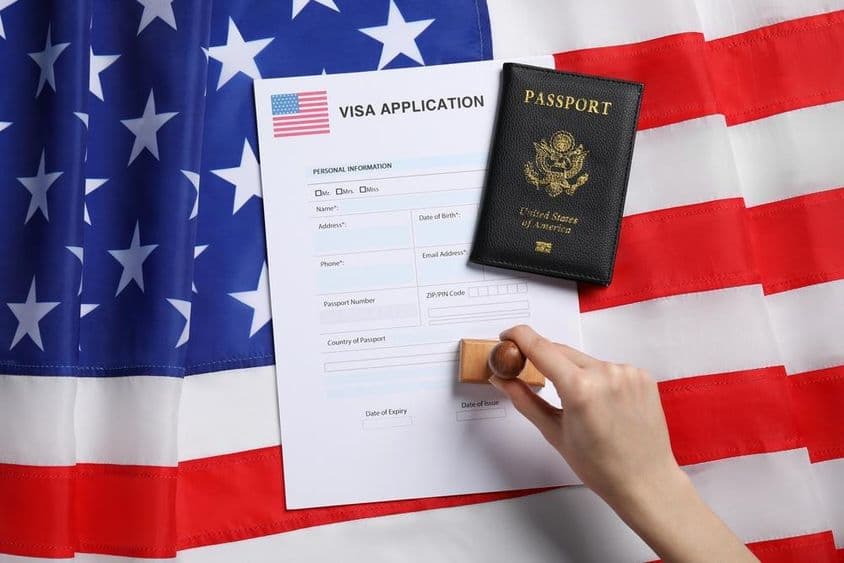 Woman stamping the visa application form.