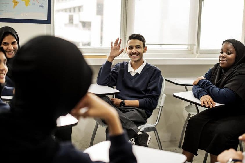 Muslim children studying in a classroom in Dubai.