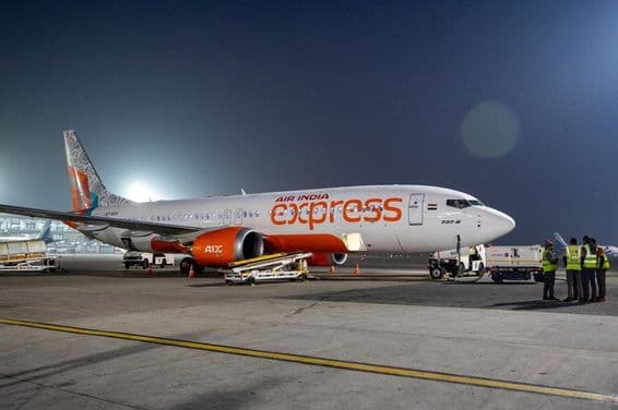 An Air India Express plane preparing for takeoff at New Delhi airport.