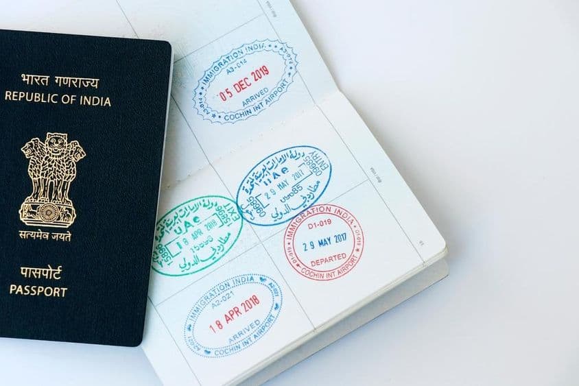 United Arab Emirates and Indian official stamps on a passport page.