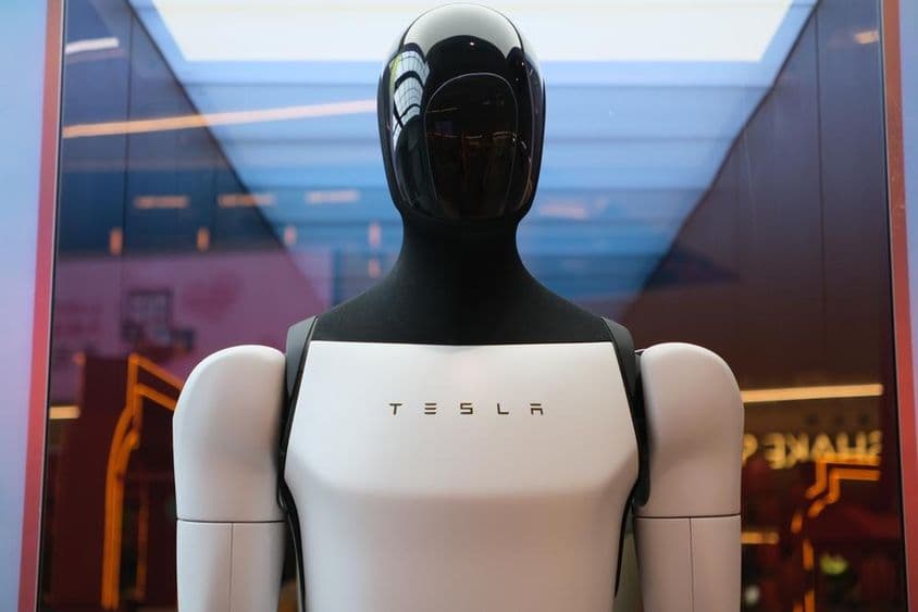 Tesla robot Optimus with brand logo.