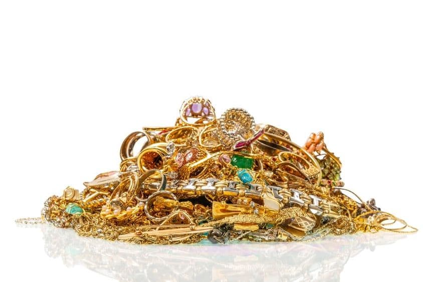 Gold jewelry collection with ruby and sapphire stones.