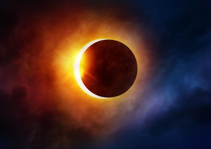 Solar eclipse as the Moon moves in front of the Sun.