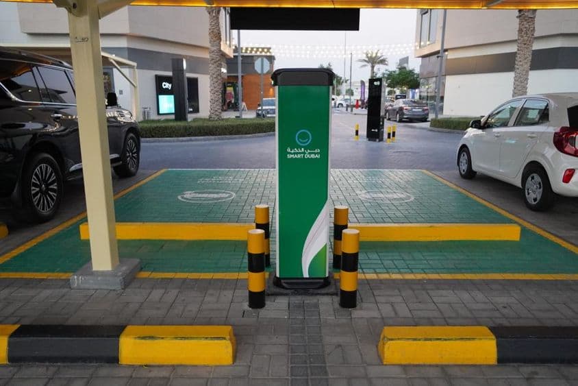 Smart electric car charging stations in a parking area in Dubai.