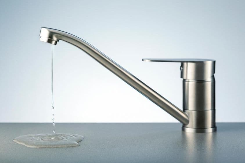 Water flowing from a faucet.