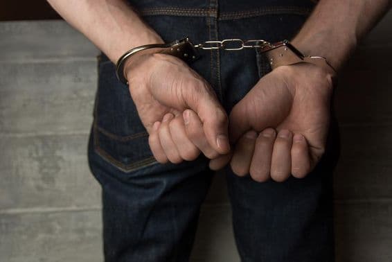 Back view of a handcuffed man.