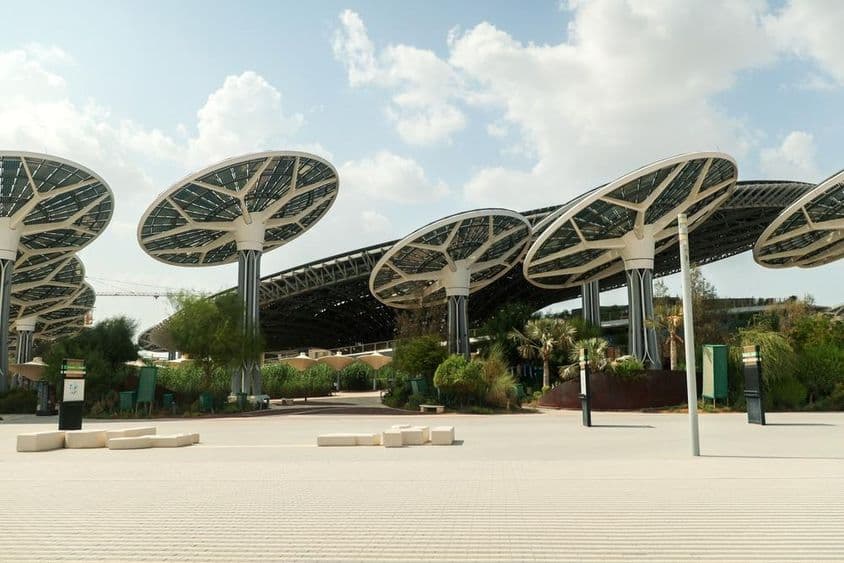 EXPO CITY DUBAI Solar panels and high structures shaped like open mushrooms.