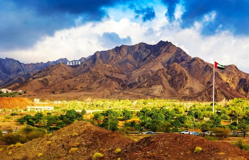 Sign welcoming visitors to Hatta city in the Hajar Mountains.