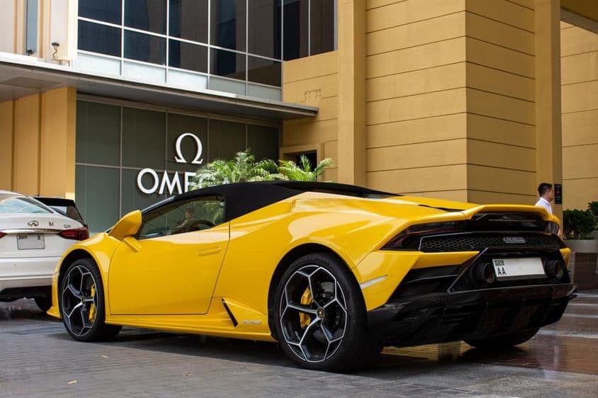 Yellow Lamborghini Huracán EVO Spyder parked at Dubai Mall.