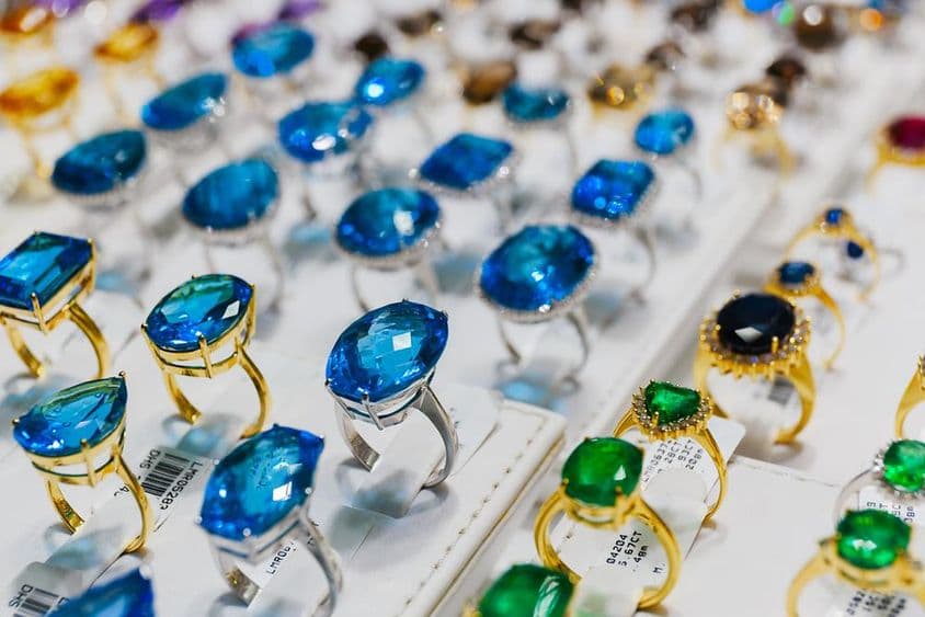 Gemstone-embellished rings at the Dubai gold market.
