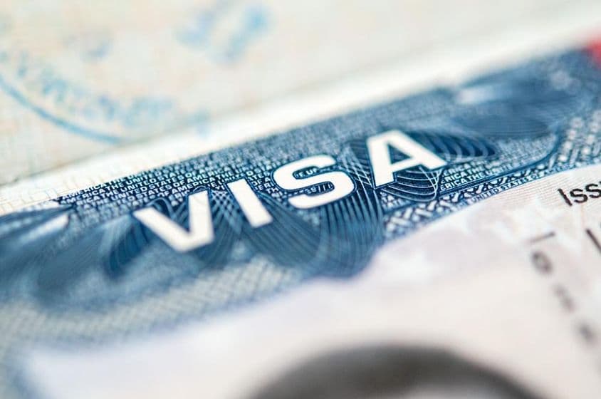 US visa stamped on a passport page.