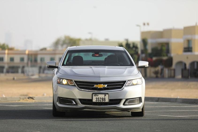 Chevrolet Impala preview on Dubai city street.