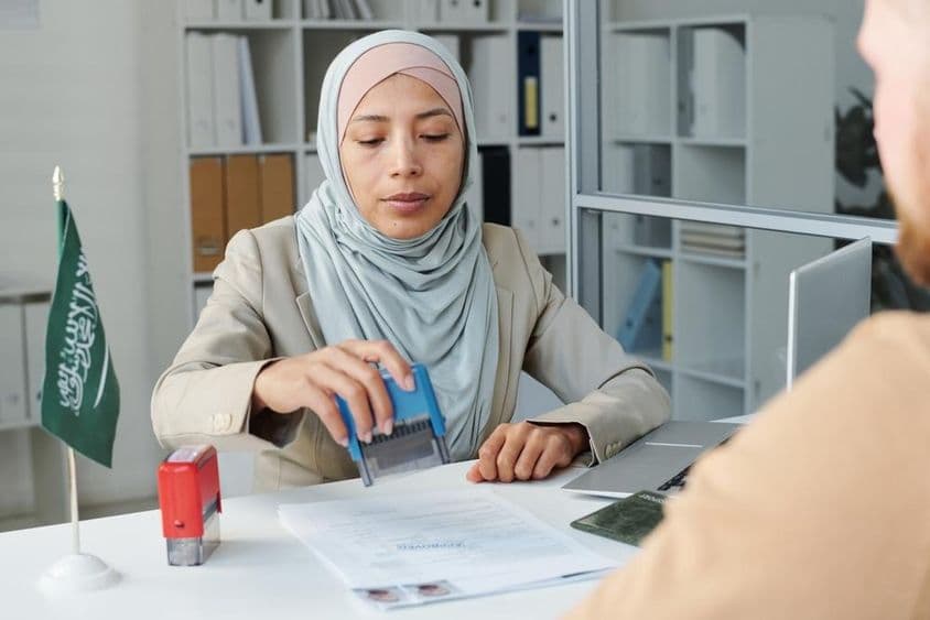Modern consular officer stamping.