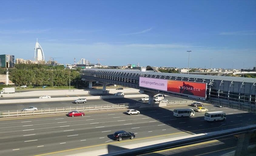 Dubai road, large roadside outdoor billboard.