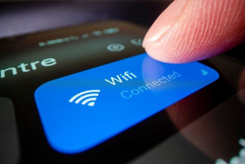 Close-up image of smartphone connecting to Wi-Fi.