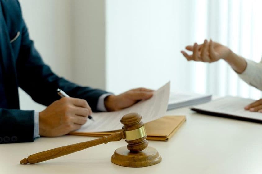 In the law office, legal documents are being prepared for the company.