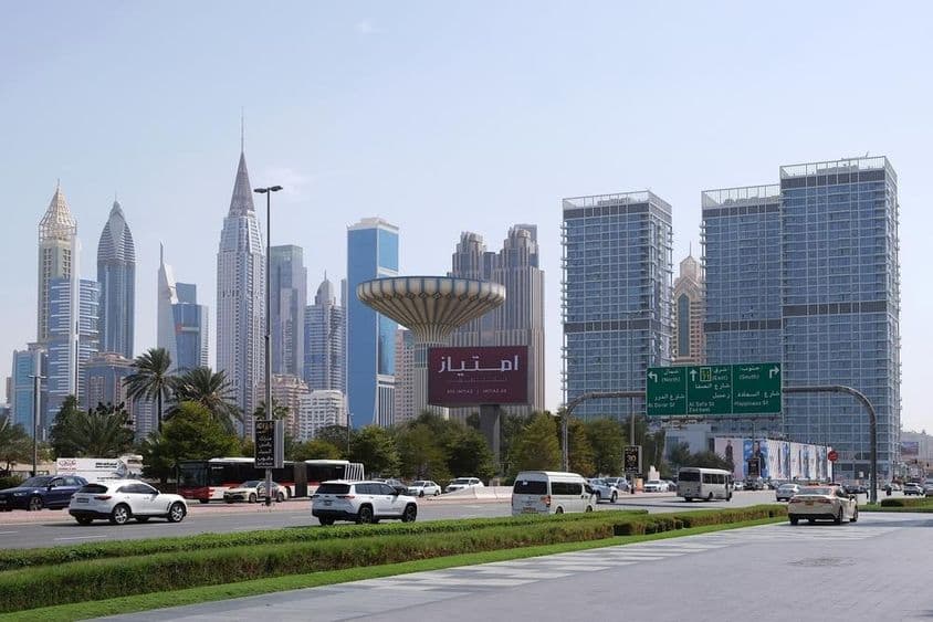 Panorama of Dubai skyscrapers seen from the road.
