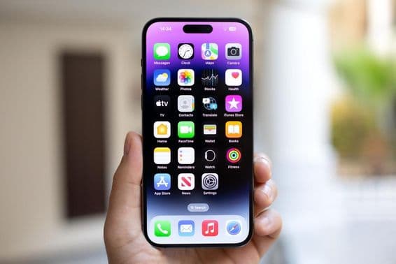 iPhone 15 Pro Max in a man's hand.
