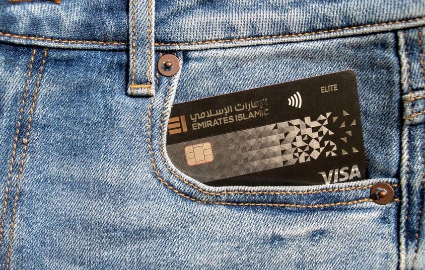 Emirates Islamic Bank plastic Visa credit card in the front pocket of jeans.