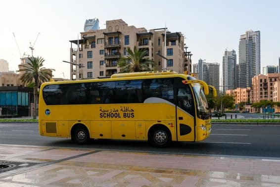 Dubai school bus in the city center.