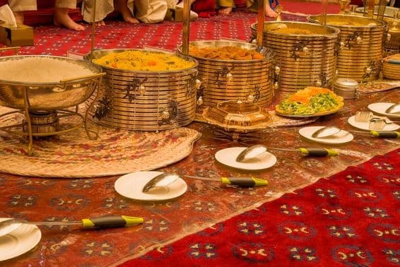 View of the golden banquet table set for guests in Dubai.