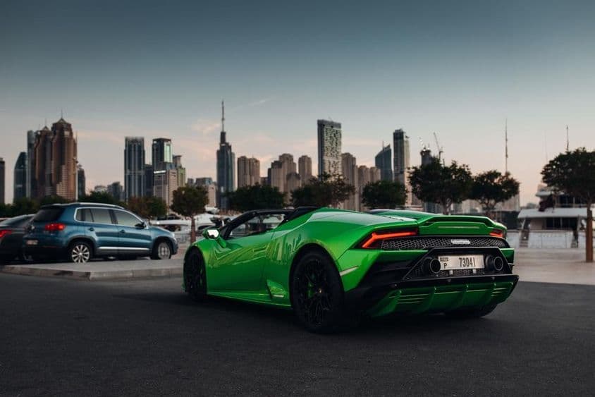 Lamborghini Huracan Spyder in a port parking lot.